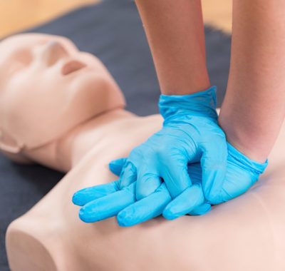 First Aid Training - Cardiopulmonary resuscitation. First aid course on cpr dummy.